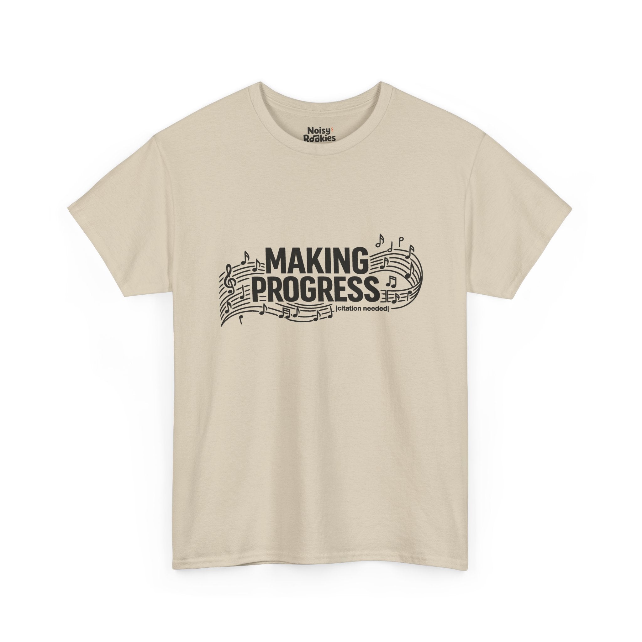 Dark-ink t-shirt design reading MAKING PROGRESS with a small "citation needed" tag, woven through a flowing musical staff with a treble clef and scattered notes.