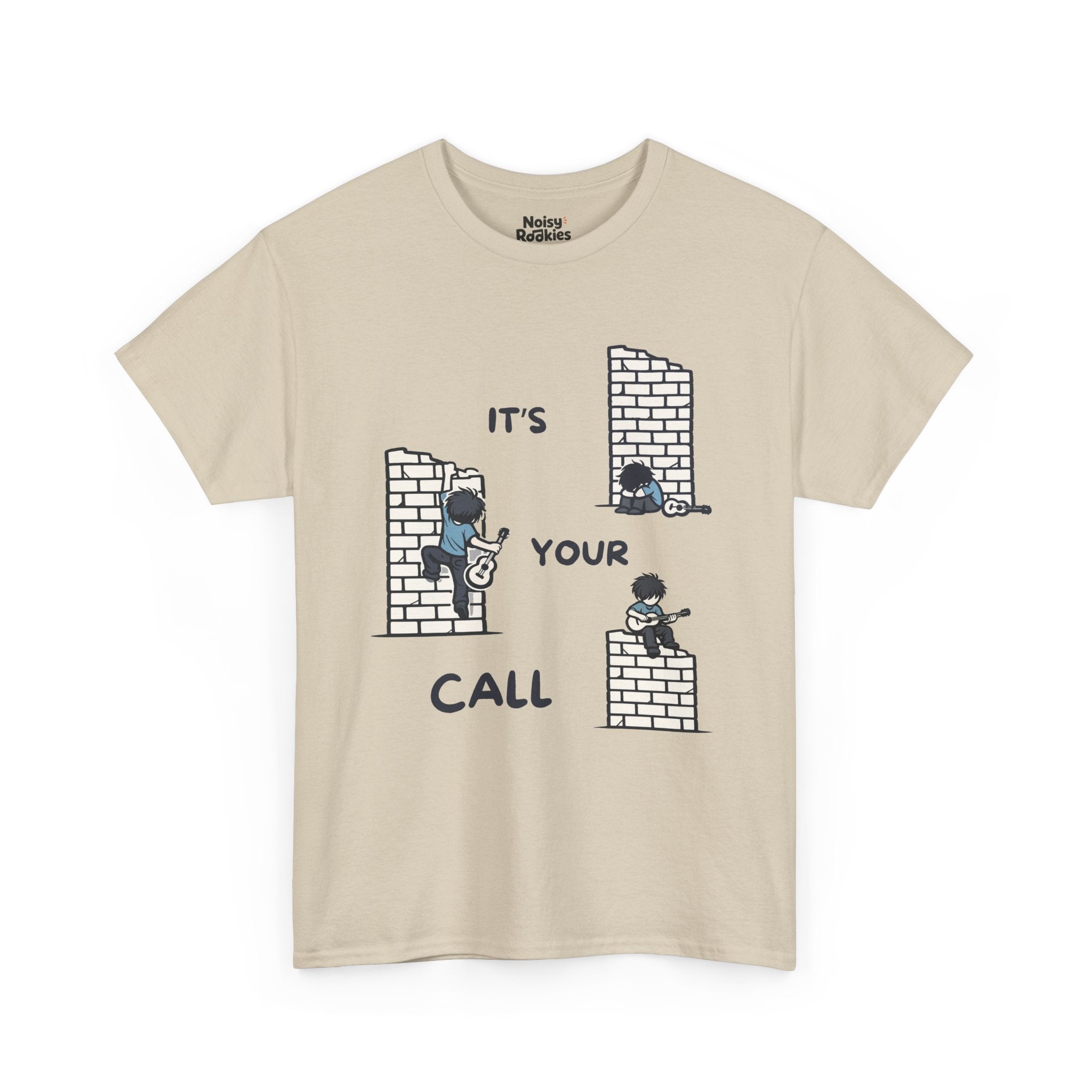 Cartoon scene on a light tee: three small guitarists at a brick wall (one slumped, one climbing, one playing on top) with the words "IT'S YOUR CALL"