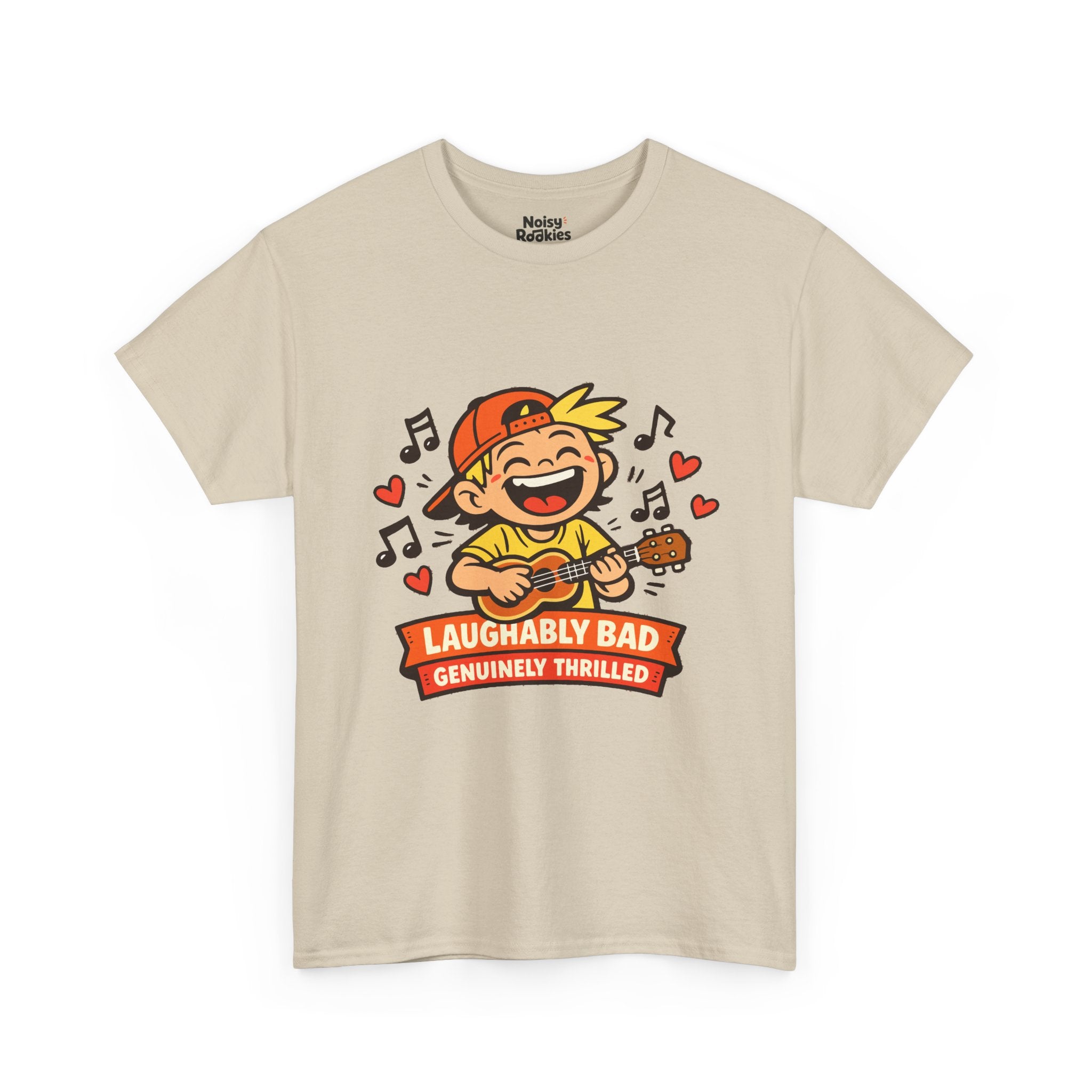 Light-shirt design of a beaming cartoon kid in a backward cap strumming a ukulele, surrounded by music notes and hearts, over a banner reading Laughably Bad Genuinely Thrilled.