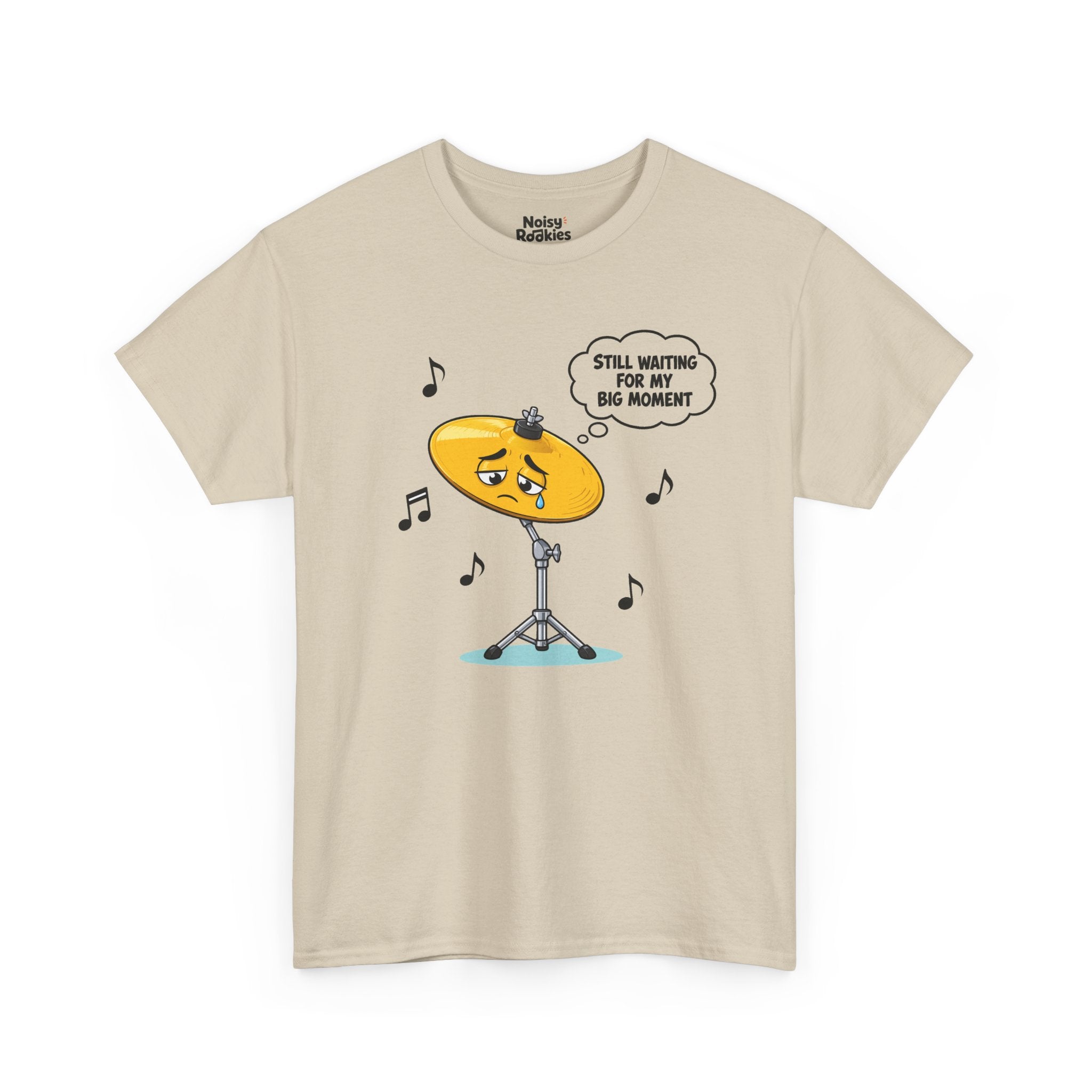 Light-shirt design of a sad cartoon cymbal on a stand with a single tear, a thought bubble reading Still Waiting for My Big Moment, surrounded by music notes.