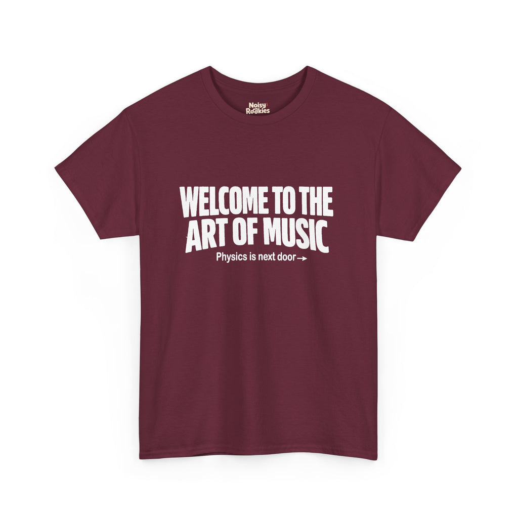 White block lettering on a dark t-shirt reading WELCOME TO THE ART OF MUSIC, with a smaller line beneath saying Physics is next door and an arrow pointing right