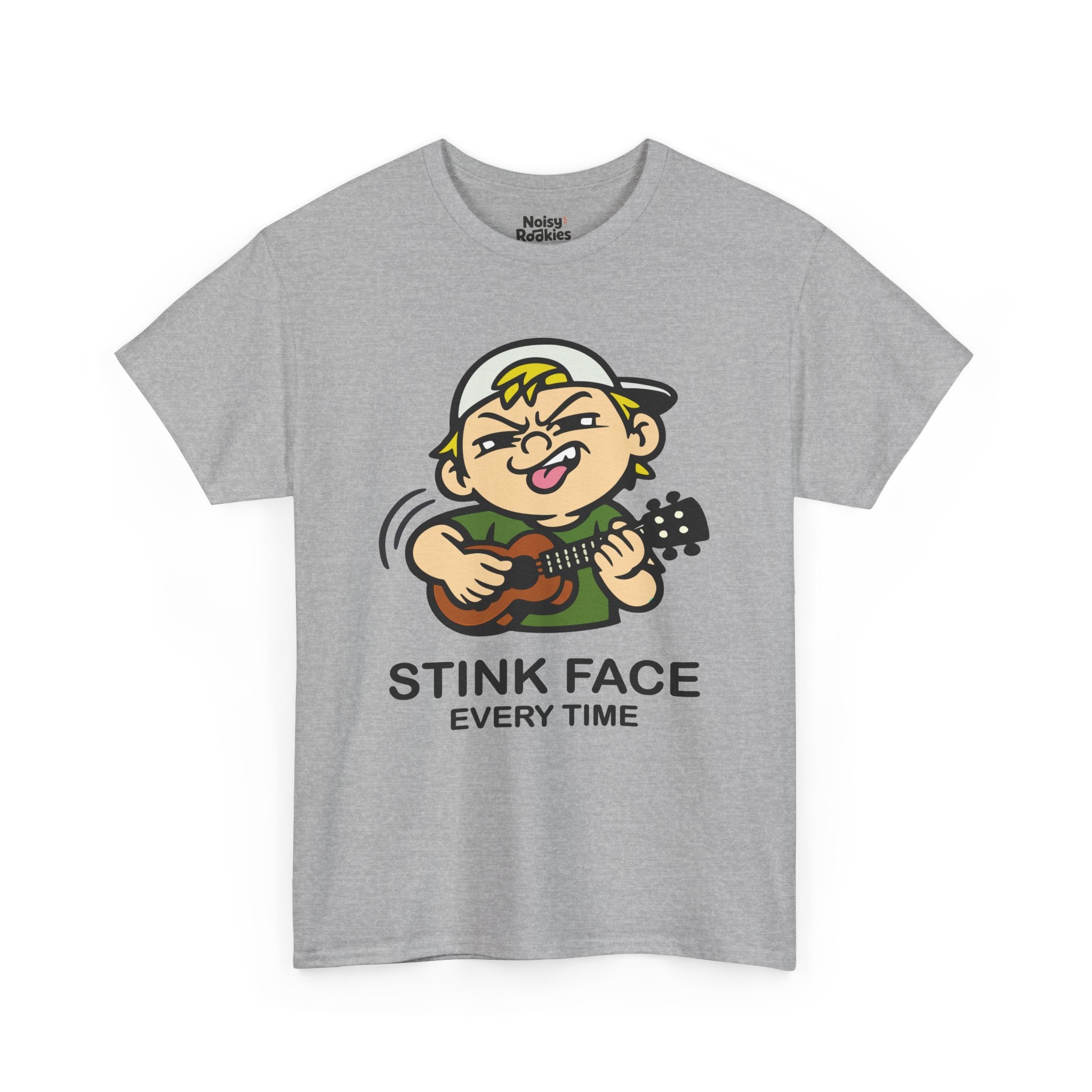 A cartoon kid in a backwards cap and a green tee strumming a ukulele, face screwed up in total concentration with the nose wrinkled, one eye squinted shut, teeth bared and tongue out, motion arcs trailing the strumming hand. Black caption beneath reads STINK FACE on the first line and EVERY TIME on the second.