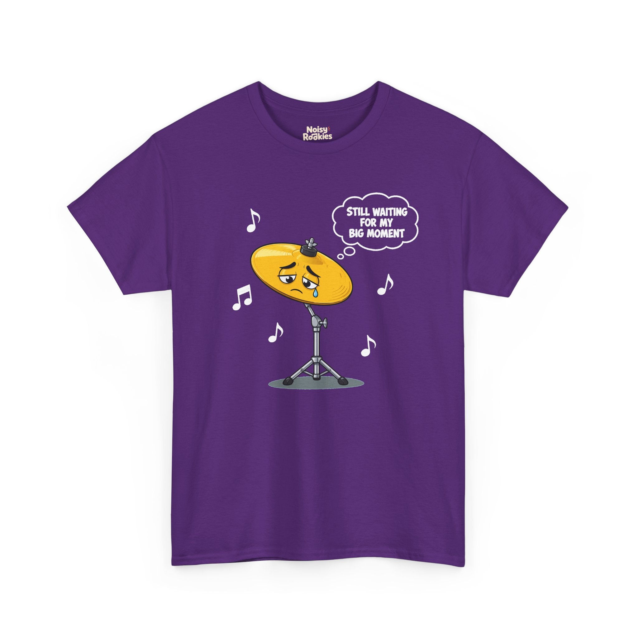 Dark-shirt design of a sad cartoon cymbal on a stand with a single tear, a thought bubble reading Still Waiting for My Big Moment, surrounded by music notes.