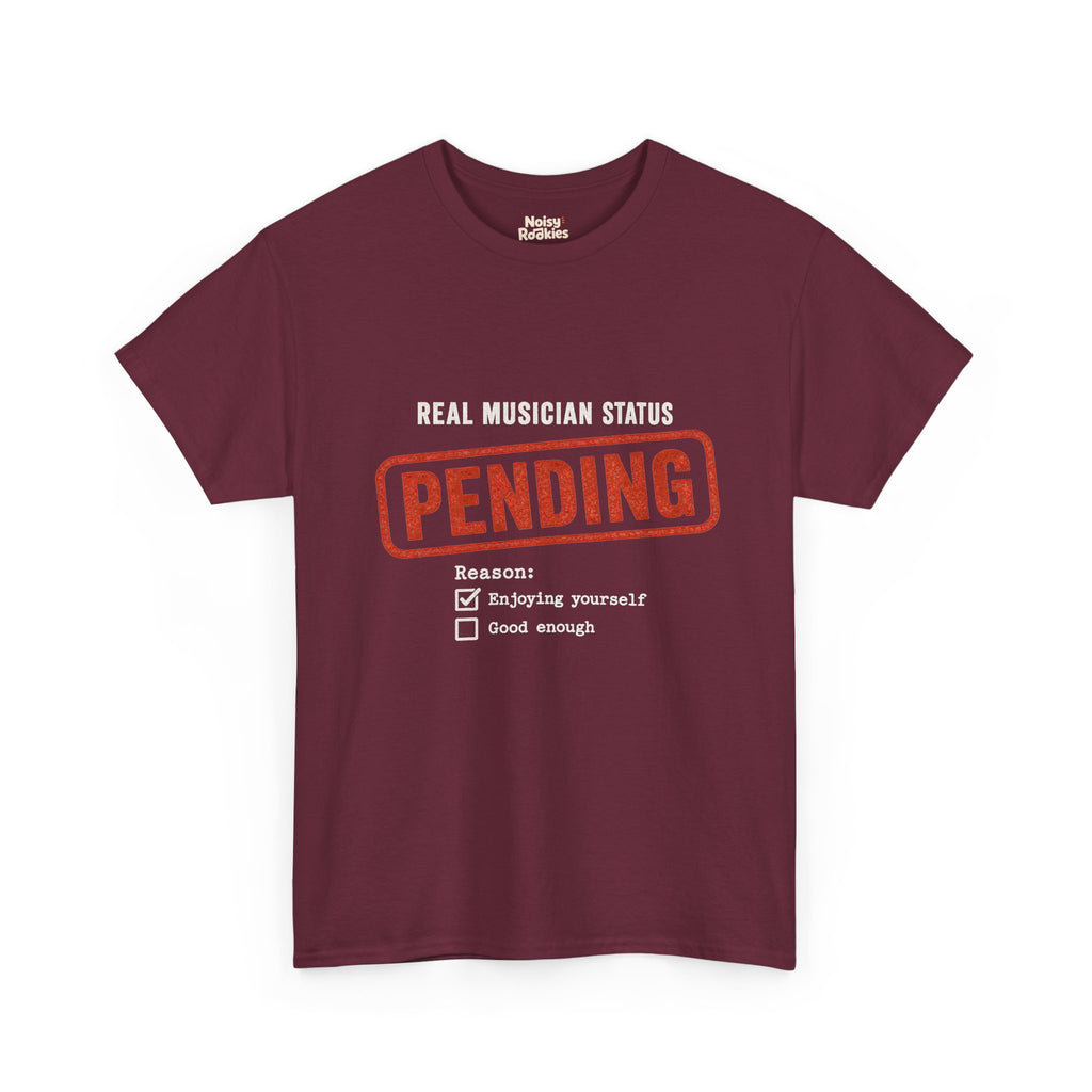 Typographic form design reading Real Musician Status with a large distressed red-orange PENDING rubber stamp, above a Reason checklist with Enjoying yourself checked and Good enough unchecked, printed in cream ink.