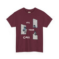 Cartoon scene on a dark tee: three small guitarists at a brick wall (one slumped, one climbing, one playing on top) with white "IT'S YOUR CALL" lettering