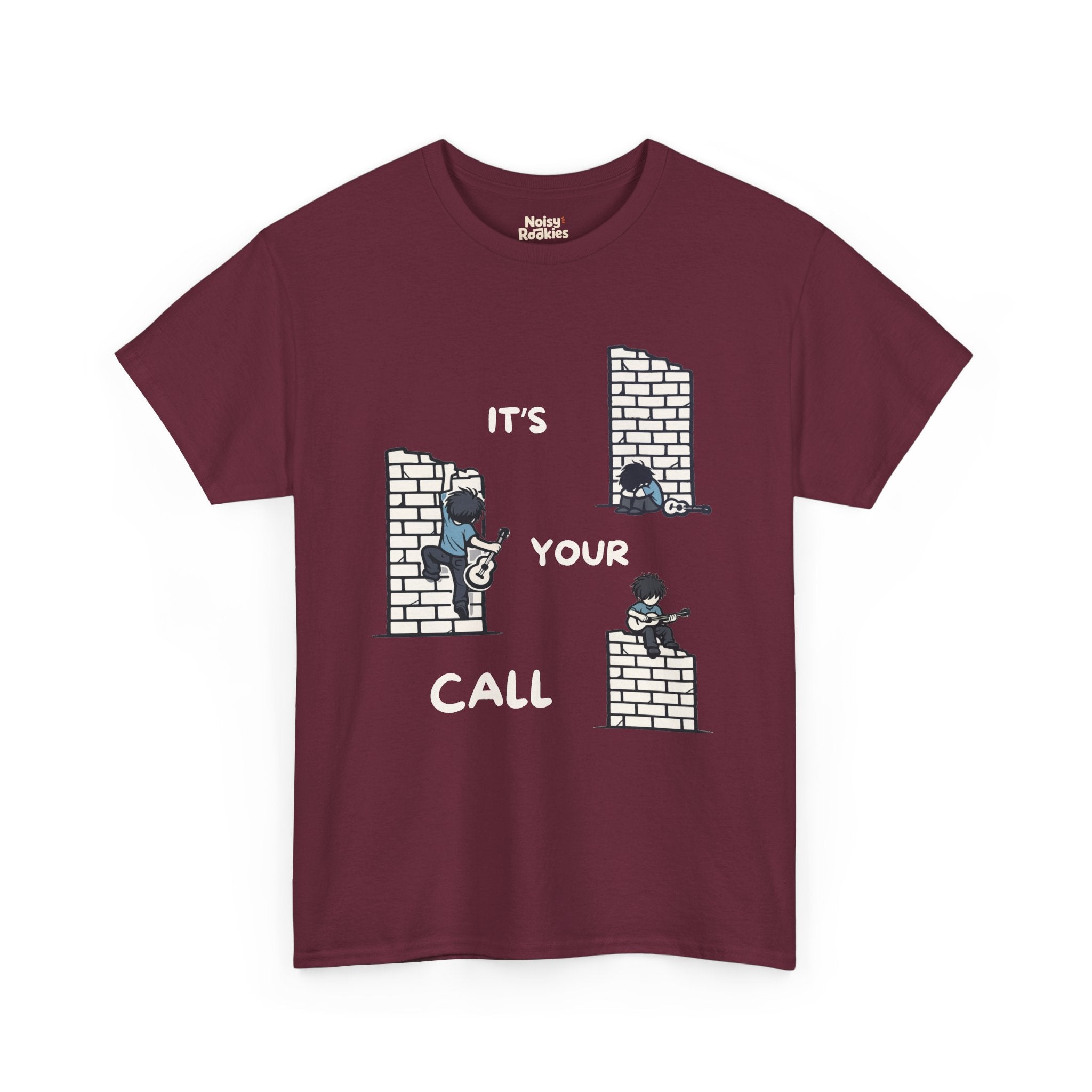 Cartoon scene on a dark tee: three small guitarists at a brick wall (one slumped, one climbing, one playing on top) with white "IT'S YOUR CALL" lettering
